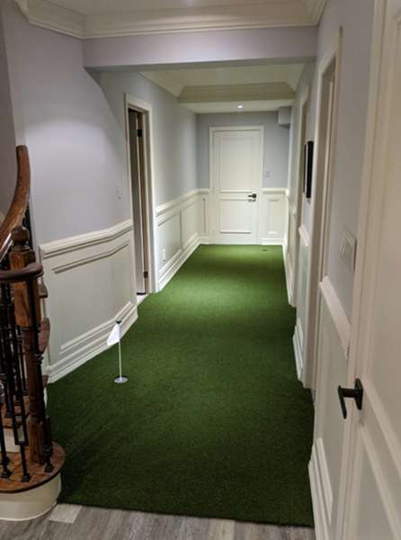 artificial turf installed in home hallway