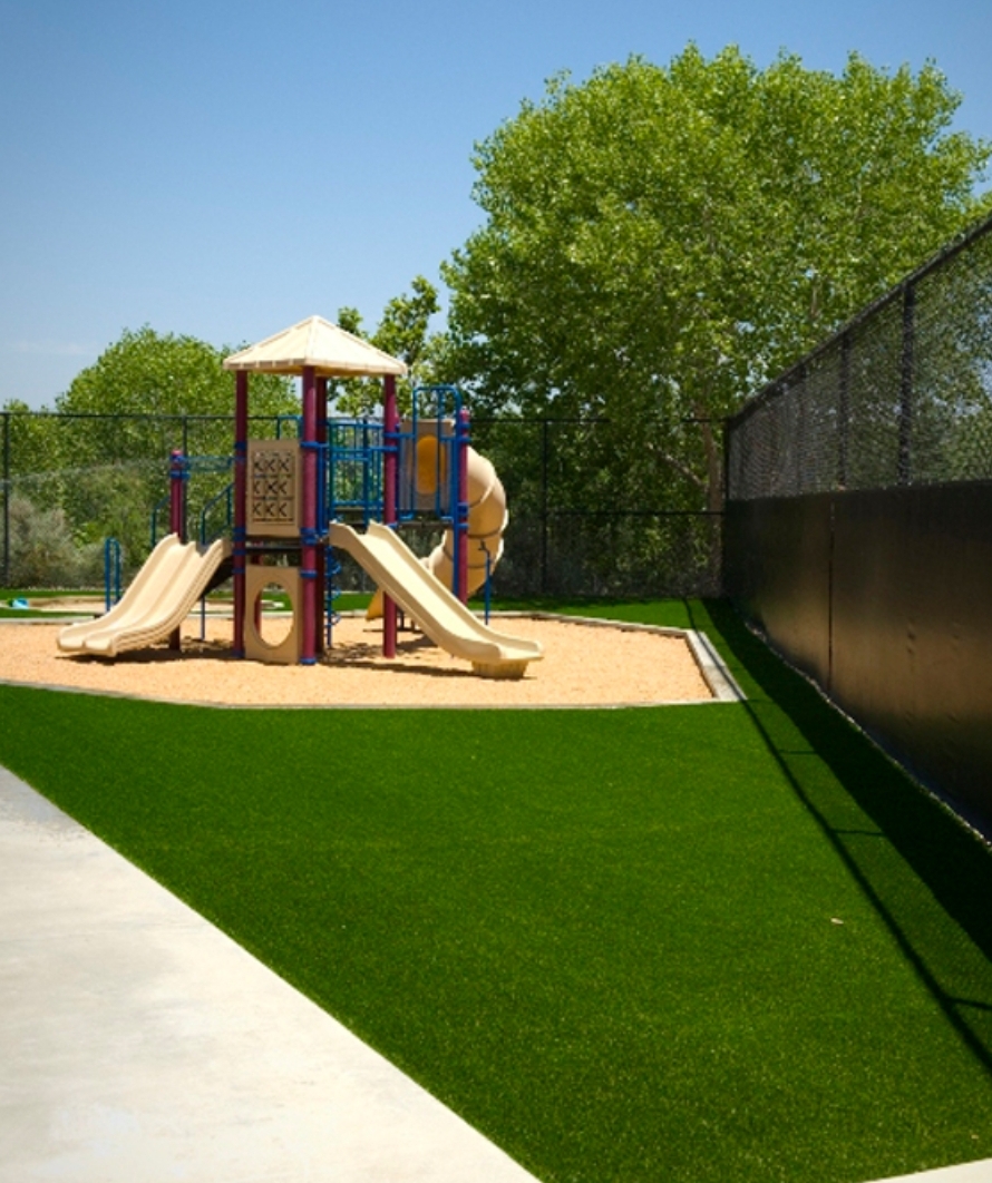 turf green aroung playground setting